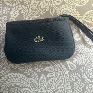 Lacoste- Navy wristlet. NWOT.  No markings